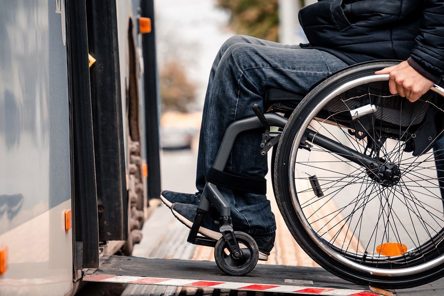 Person in a wheelchair enters vehicle with ramp upfit