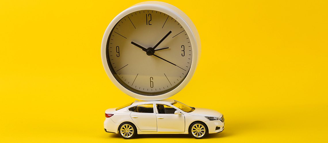 Car with a clock on the roof of it