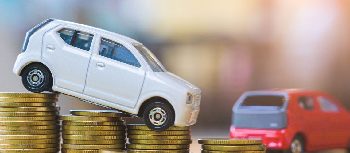 Miniature Vehicles on stacks of coins for fleet vehicle savings