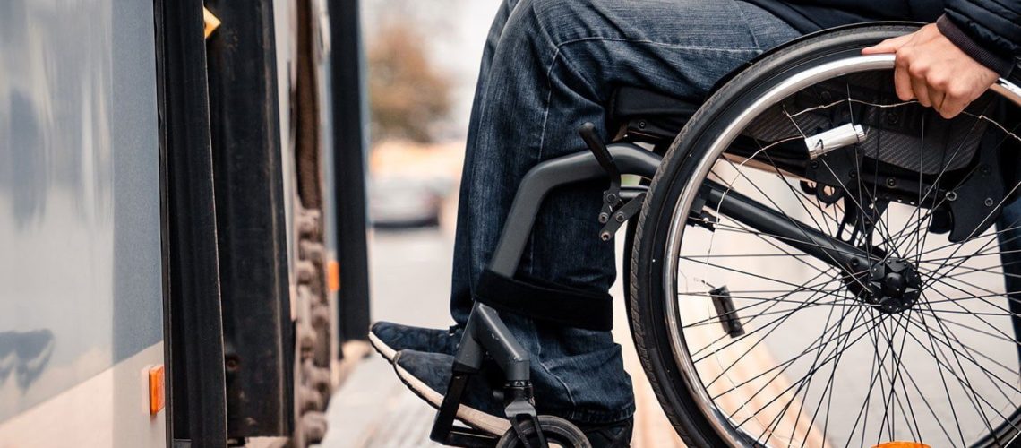 Person in a wheelchair enters vehicle with ramp upfit